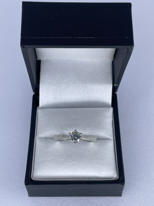 Flanked Solitaire Ring